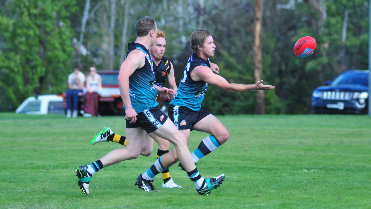 TAPPING ON: Bathurst Bushrangers' Matt Archer tries to gain control of the ball on Saturday. Photo: JUDE KEOGH