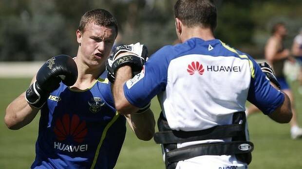 WORKING HARD: Jack Wighton (left) pushes himself during a Canberra Raiders' pre-season fitness session. Photo: JEFFREY CHAN