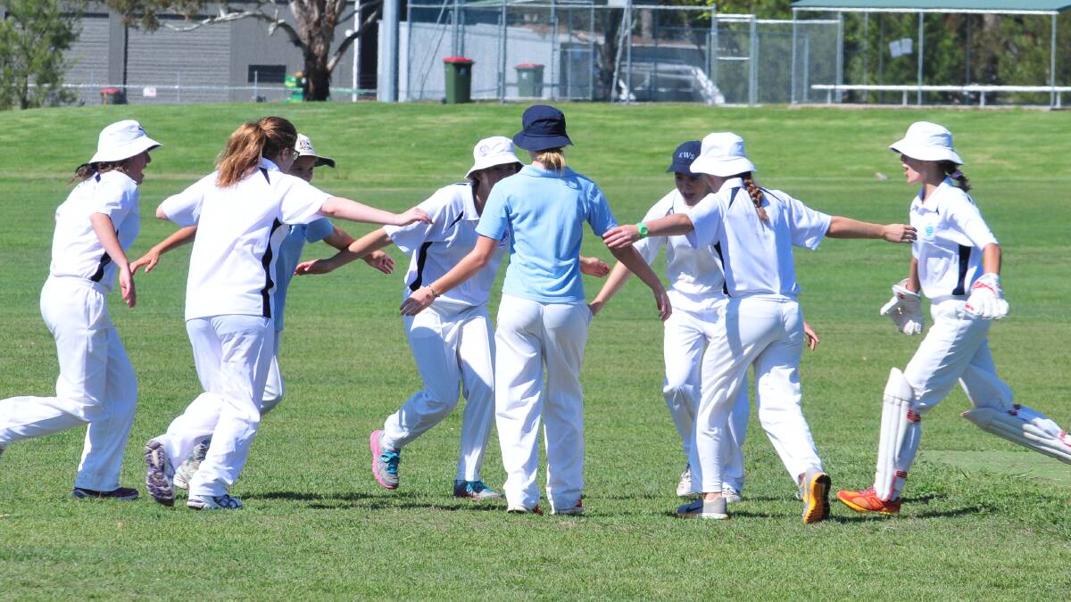 CRICKET: Kinross girls celebrate a wicket on Saturday morning. Photo: JUDE KEOGH