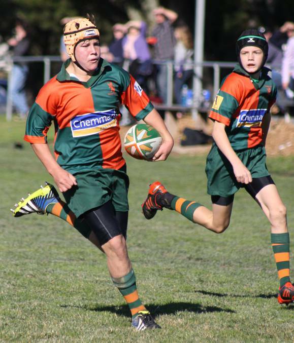 IN THE CLEAR: Orange City's Beau Westcott on his way to scoring a try in the under 13s match against Parkes earlier in the season. Photo: MICHELLE COOK 0621mcjsport5
