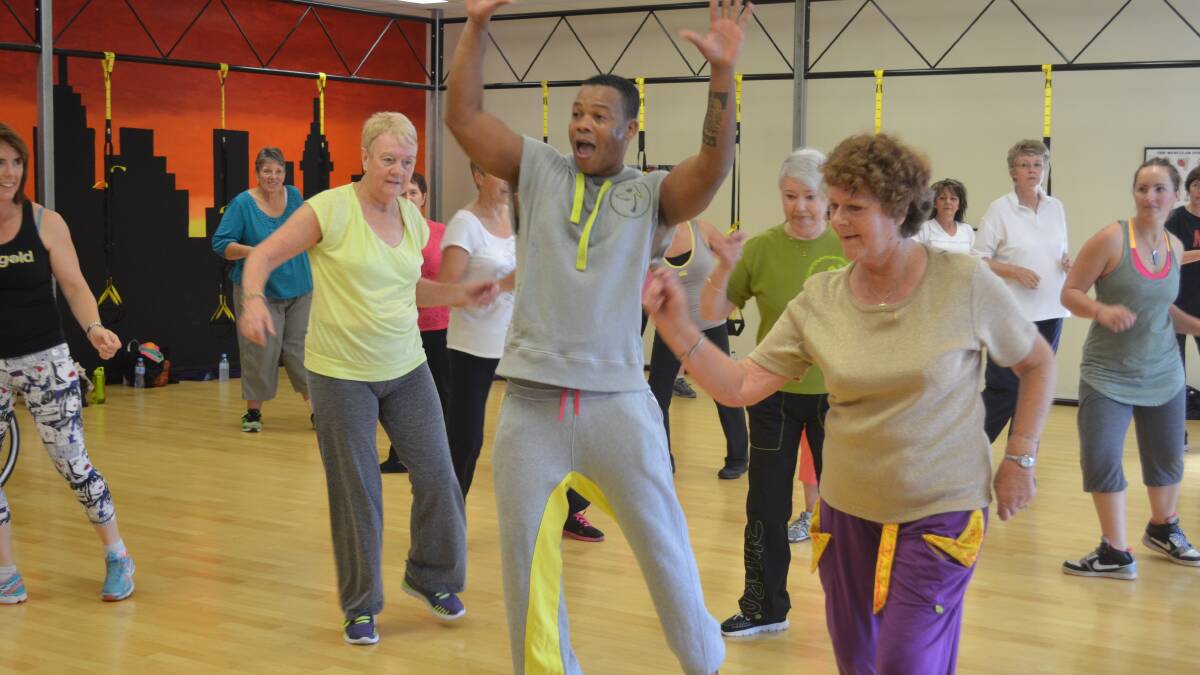 Smiling faces and toned bodies work out with one of the world's best instructors