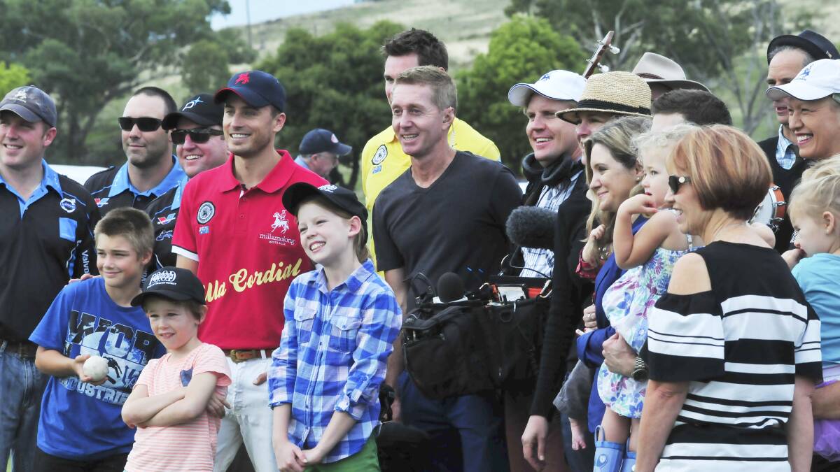 Onlookers pose for a photo with the Sunrise crew James Tobin, Mark Wilkinson and AndyCichanowski. Photo: JUDE KEOGH