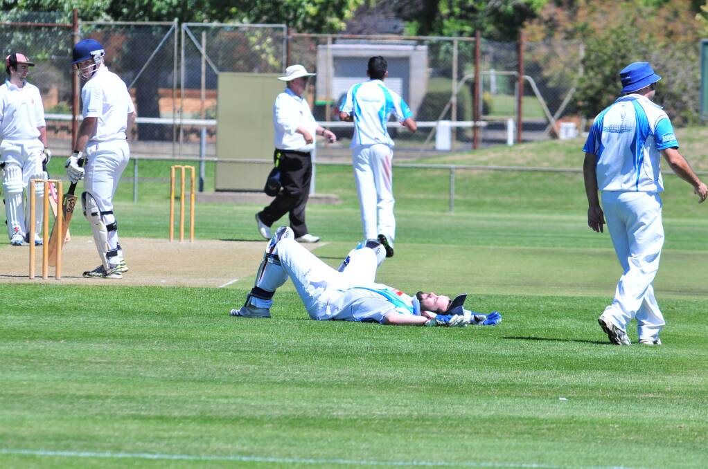 CRICKET: Waratahs wicketkeeper Jack Meek takes a breather during Saturday's loss to Centrals at Wade Park. Photo: JUDE KEOGH