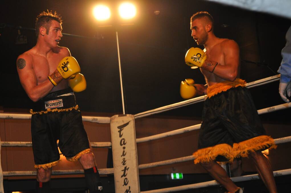 THE BIG FIGHT: Sam Ah-See and Shannon 'Shaggy' King in the ring at the Orange Function Centre on Friday night. Photo: NICK MCGRATH