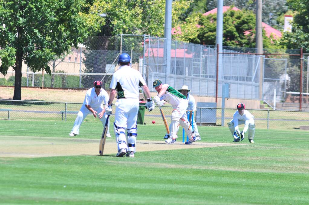 CRICKET: Orange CYMS Nick Garton defends a ball against Centrals at Wade Park in Saturday's ODCA first grade game. Photo: JUDE KEOGH
