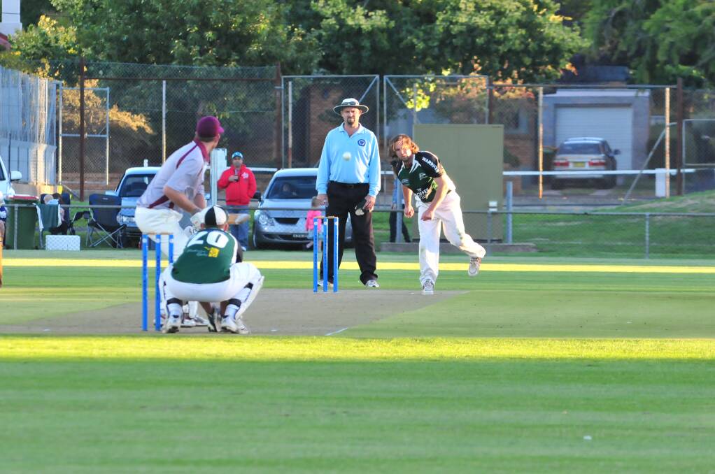 CRICKET: Orange City's Ben Findlay bowls to Cavaliers' Brad Wright in Friday night's Royal Hotel Cup final. Photo: JUDE KEOGH