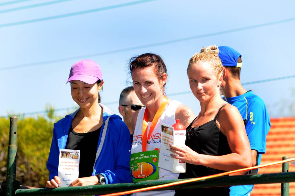 TOP THREE: Shayne Falkenmire (right), Sue Dean (middle) and Akiko Akashi were the first three home in the women's marathon. Photo: STEVE GOSCH