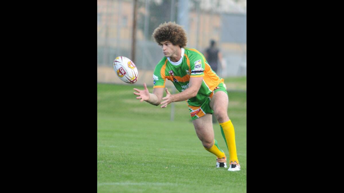ORANGE CYMS: Matt King collects the ball during his cameo with the green and golds. Photo: STEVE GOSCH