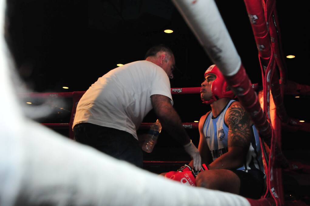 BOXING: Orange Hawks' Lofi Mataele takes a breather during his exhibition bout against Sam Coyte at the Orange Function Centre on Friday night. Photo: JUDE KEOGH