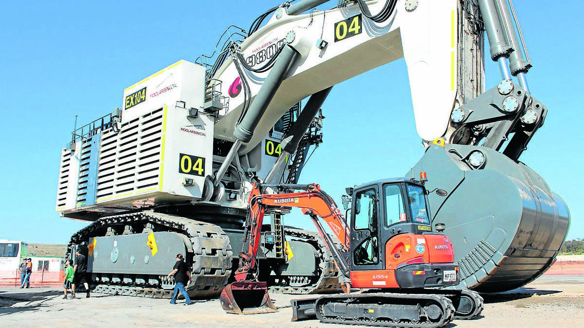 MUDGEE: The new Liebherr R 9800 Excavator purchased by Moolarben Coal is one of the biggest excavators in the world. The new machine is pictured with a standard excavator, found on many building sites around Mudgee.