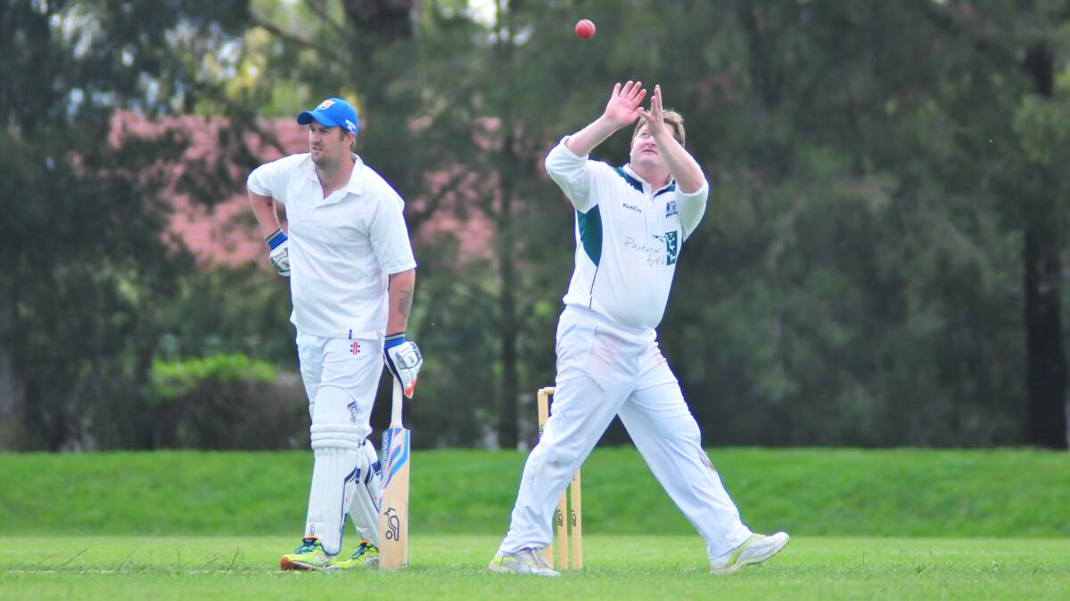 SECOND GRADE: Wanderers' batsman Scott Kennedy stands by as Orange City bowler Dave Boundy collects the ball in Saturday's grand final action at Max Stewart. Photo: JUDE KEOGH