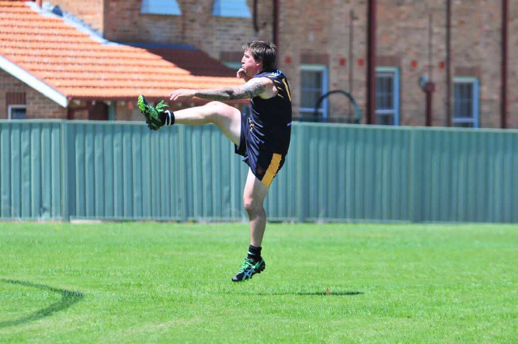 AUSSIE RULES: Orange Tigers' Christian Kelly launches into his work during Saturday's trial game. Photo JUDE KEOGH