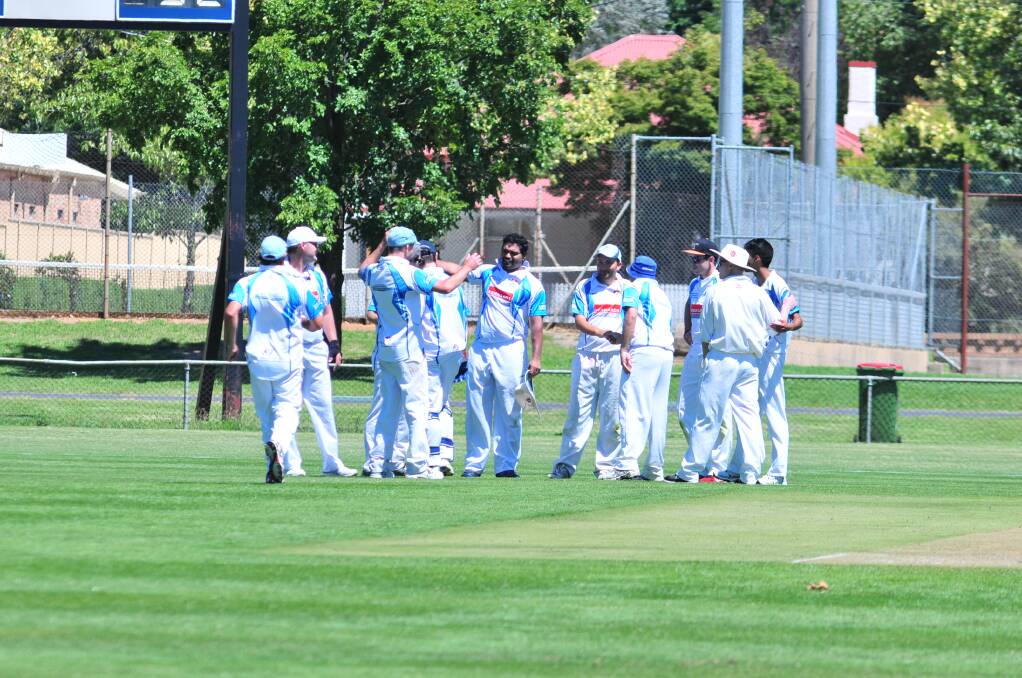 CRICKET: Waratahs celebrate a wicket against Centrals in Saturday's ODCA first grade game at Wade Park on Saturday. Photo: JUDE KEOGH