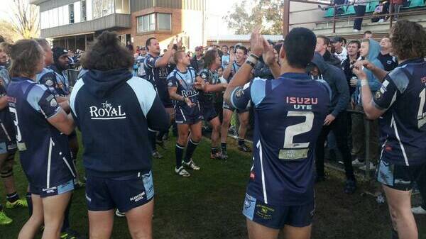 HAPPY DAYS:Justin Howarth and Mitch Hurford lead Hawks' in their victory song. Photo: MATT FINDLAY