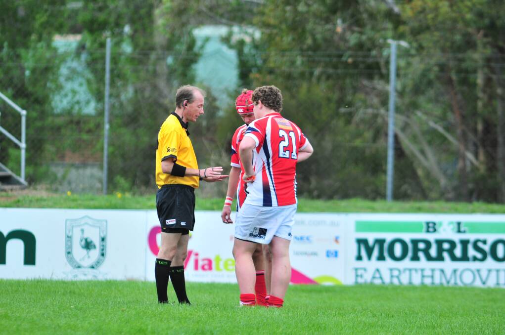 WORD OF WARNING: Max Coughlan talks with referee Jarrod Simpson. Photo: JUDE KEOGH
