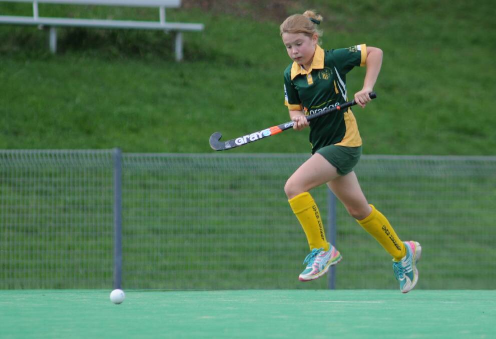 HOCKEY: Sophie Whittaker breaks free of the defence in her under 12s game on Saturday. Photo: STEVE GOSCH