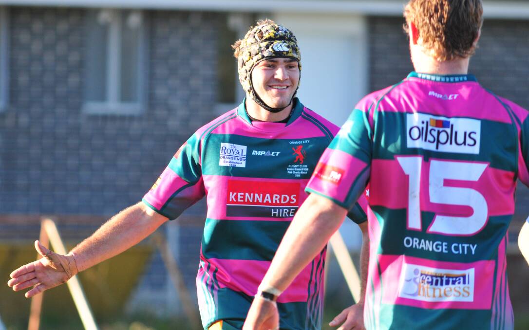 YOUNG TALENT TIME: Orange City Lions' Duncan Young is all smiles after scoring a try in his side's Blowes Clothing Cup win over the Bathurst Bulldogs at Pride Park on Saturday. Photo: JUDE KEOGH