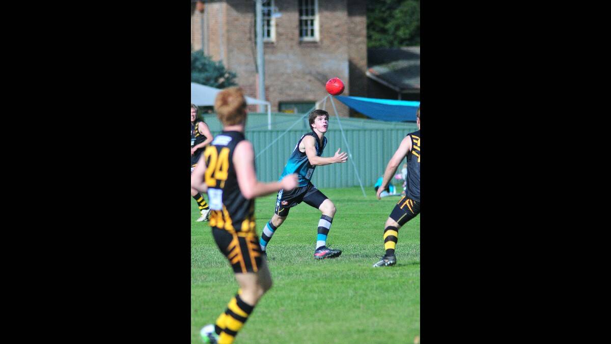 EYES ON THE PRIZE: Bathurst Bushrangers' Bill Watterson can't look away as the ball crosses his path. Photo: JUDE KEOGH