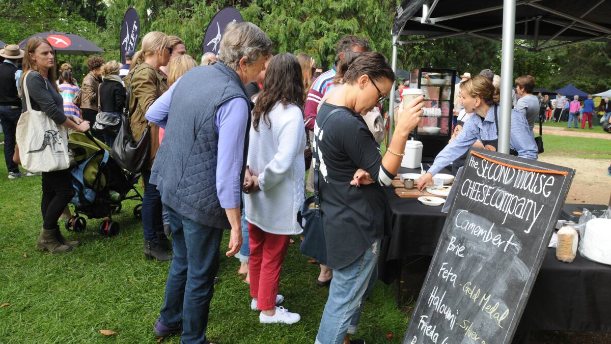 PRODUCERS MARKETS: Checking out the menu options in Cook Park. Photo: STEVE GOSCH