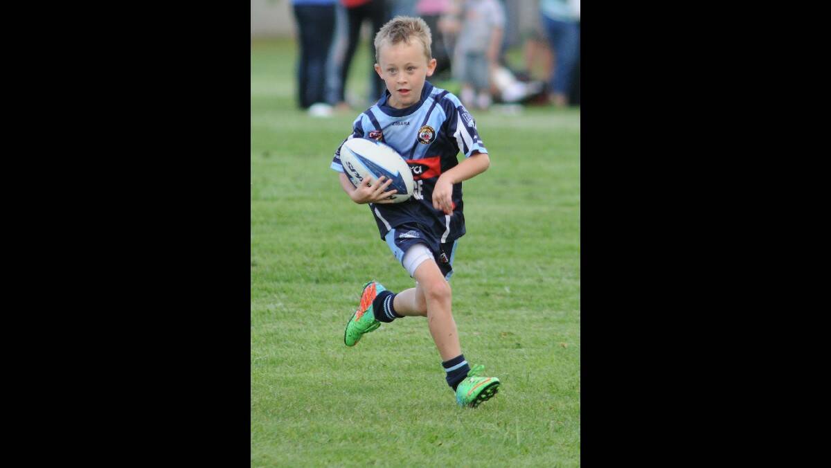 RUGBY LEAGUE: Bloomfield Tigers under 12s' Riley Dane streaks into open space in his side's game against CYMS on Saturday. Photo" STEVE GOSCH