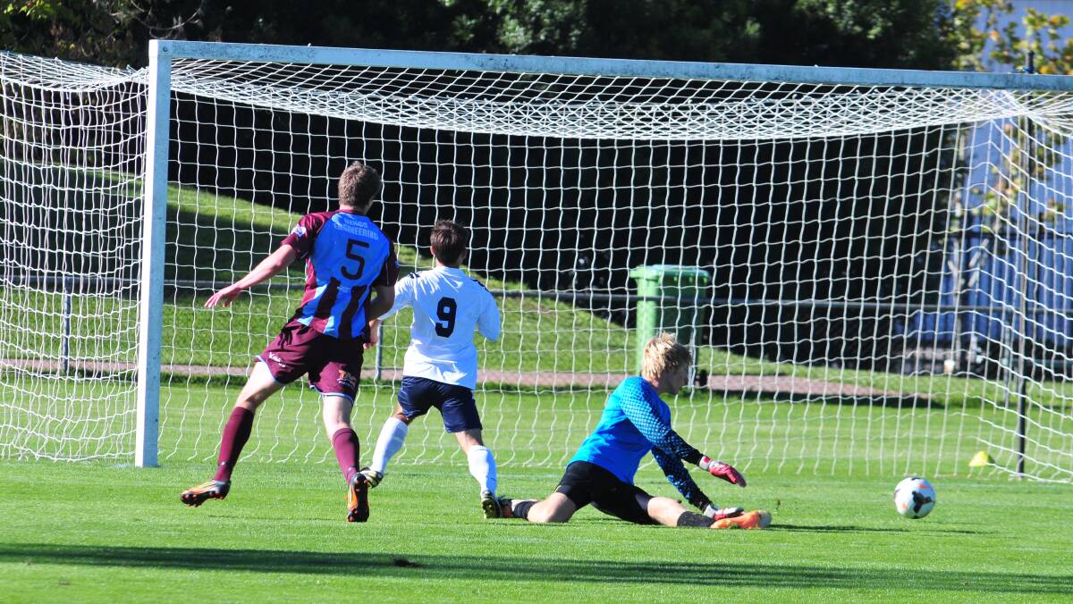 UNDER 18S: A goal-scoring opportunity goes astray at Wade Park. Photo: JUDE KEOGH