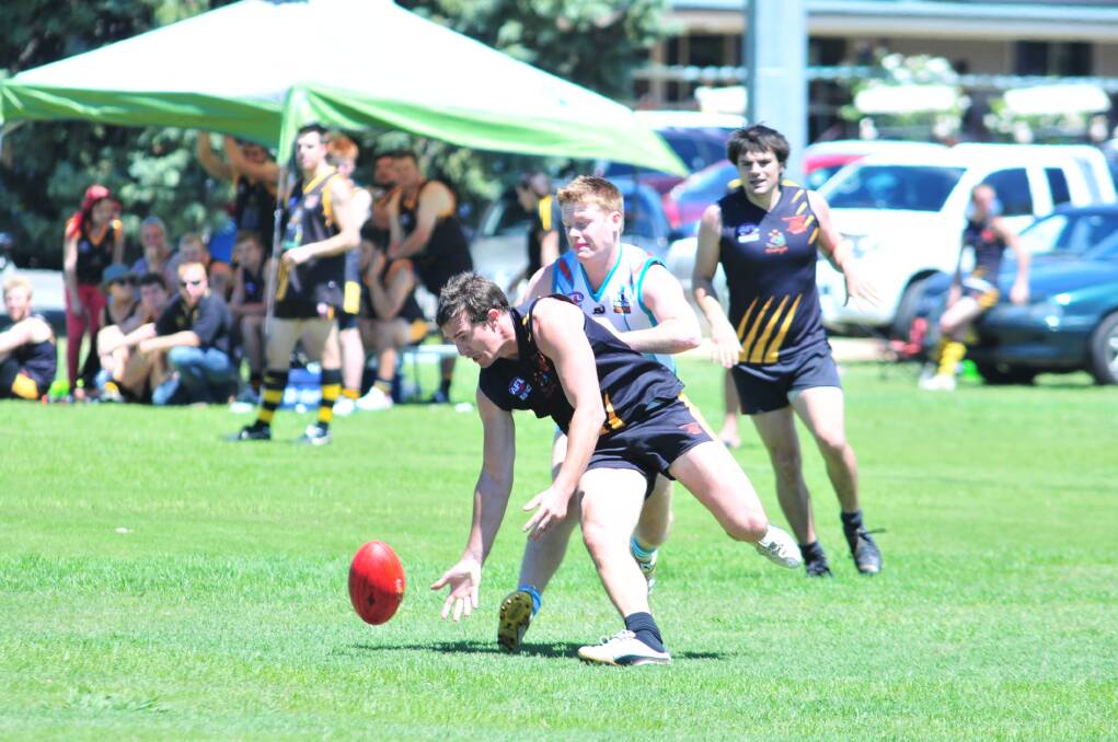 AUSSIE RULES: Josh Bubnich and Chris Nolan battle for possession in Saturday trial game. Photo: JUDE KEOGH