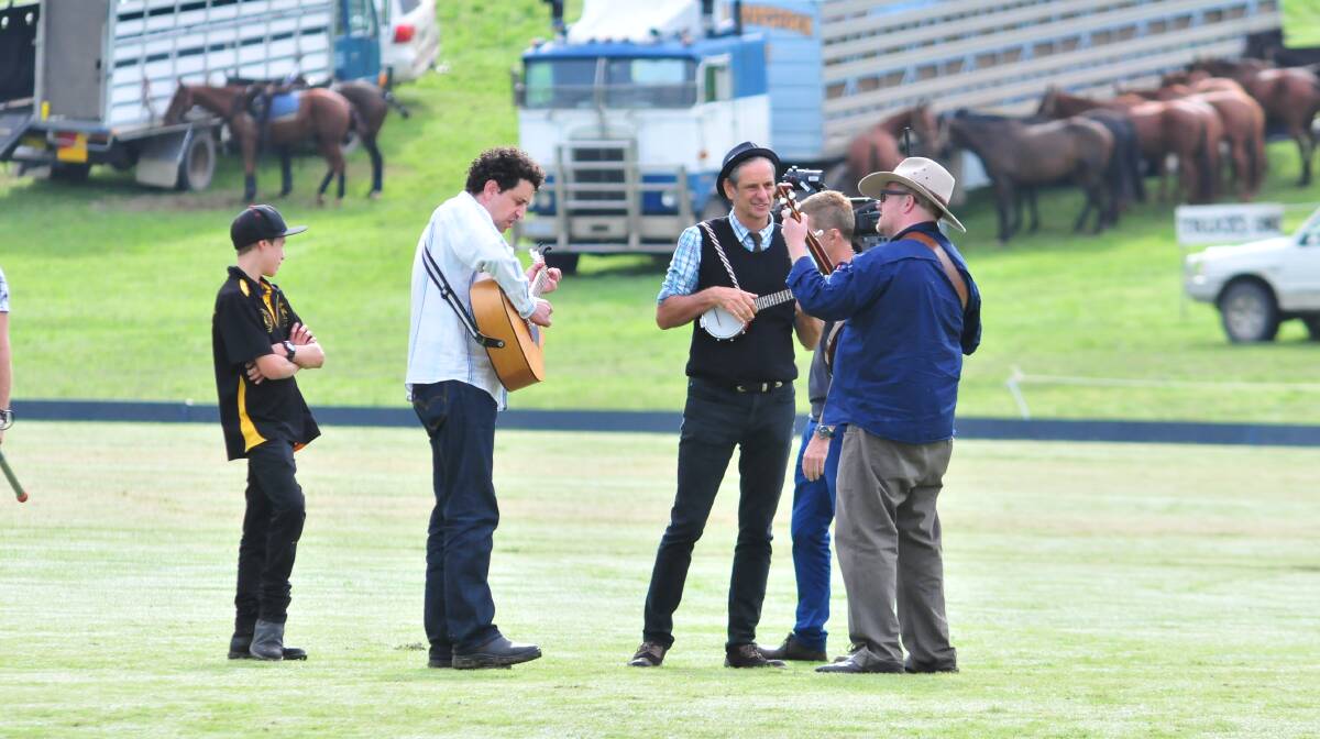 Tony Mansfield (guitar), Ken Smith (banjo) and Alex Pearson (banjo) make up The Honeydrippin Mudskippers, who played a tune in the middle of the polo field before the first match. Photo: JUDE KEOGH