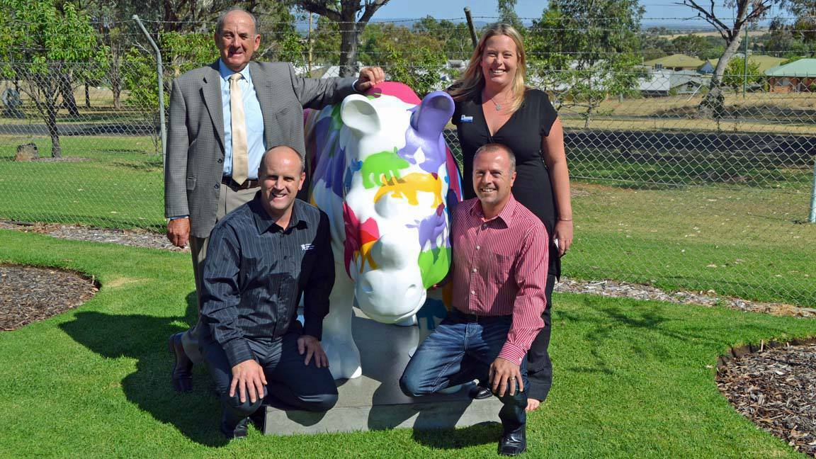 COWRA: Mayor Bill West, Cowra Japanese Garden manager Justin Smith, Cowra Tourism manager Belinda Virgo and Cowra Tourism board member Andrew Grinter get up close and personal with Cowra's new resident.