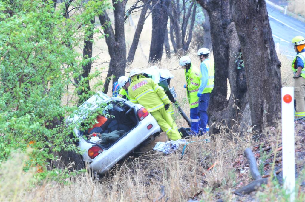 OFF ROAD: Images from the car accident on The Escort Way on Wednesday afternoon which saw a woman trapped in her car. Photos: JUDE KEOGH