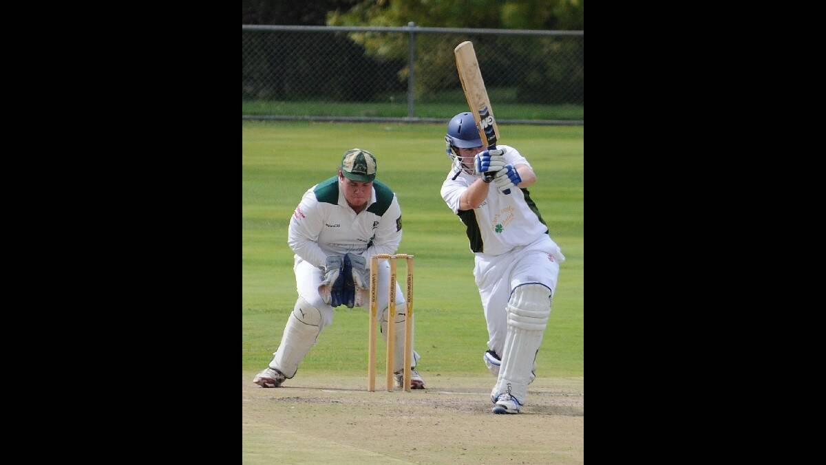 CRICKET: Orange CYMS skipper Hugh Le Leivre on the drive as Orange City counterpart Matt Findlay watches on at Riawena Oval on Saturday. Photo: STEVE GOSCH