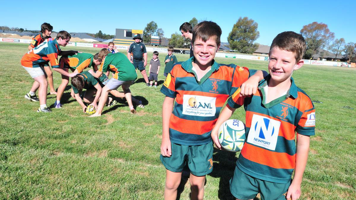 ORANGE: Harry West and Blair Ward (front) are excited for the season ahead as (ruck) Ricky Eggins, Noah and Angus Ward, Tim Dalton, Luke Alexander and Hunter Ward jam in some breakdown work while Trixie and Oscar Ward, Oliver and Angus Goudge watch. Photo: JUDE KEOGH 0130jrrugby3