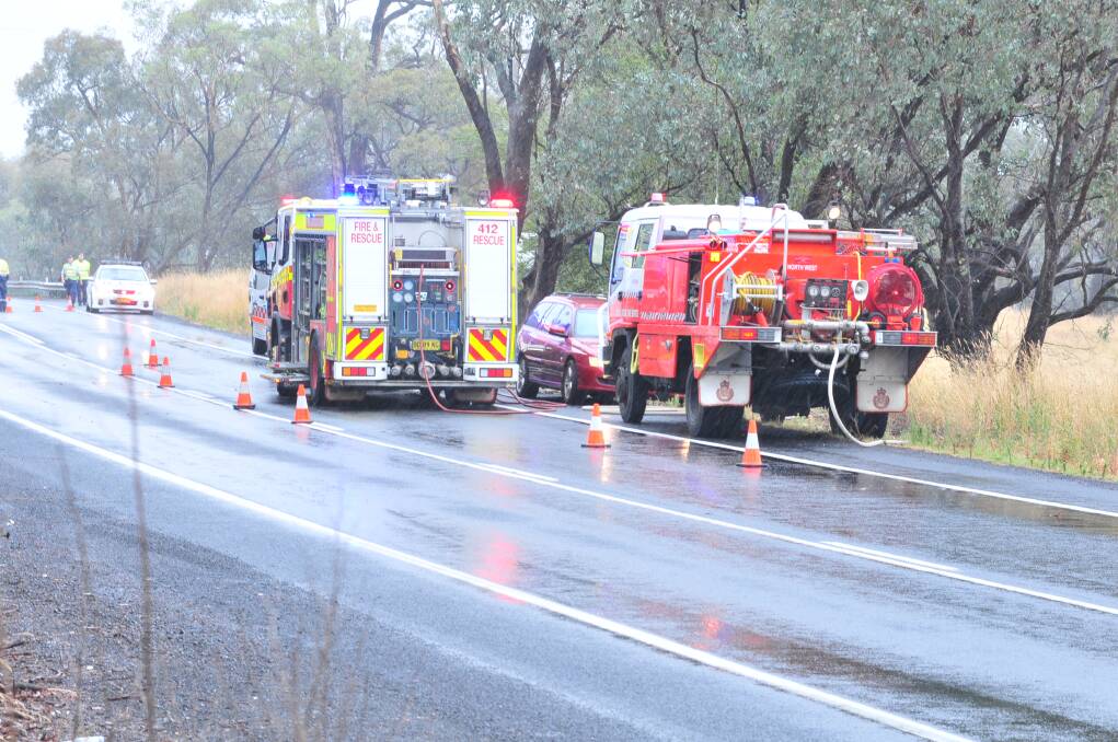OFF ROAD: Images from the car accident on The Escort Way on Wednesday afternoon which saw a woman trapped in her car. Photos: JUDE KEOGH