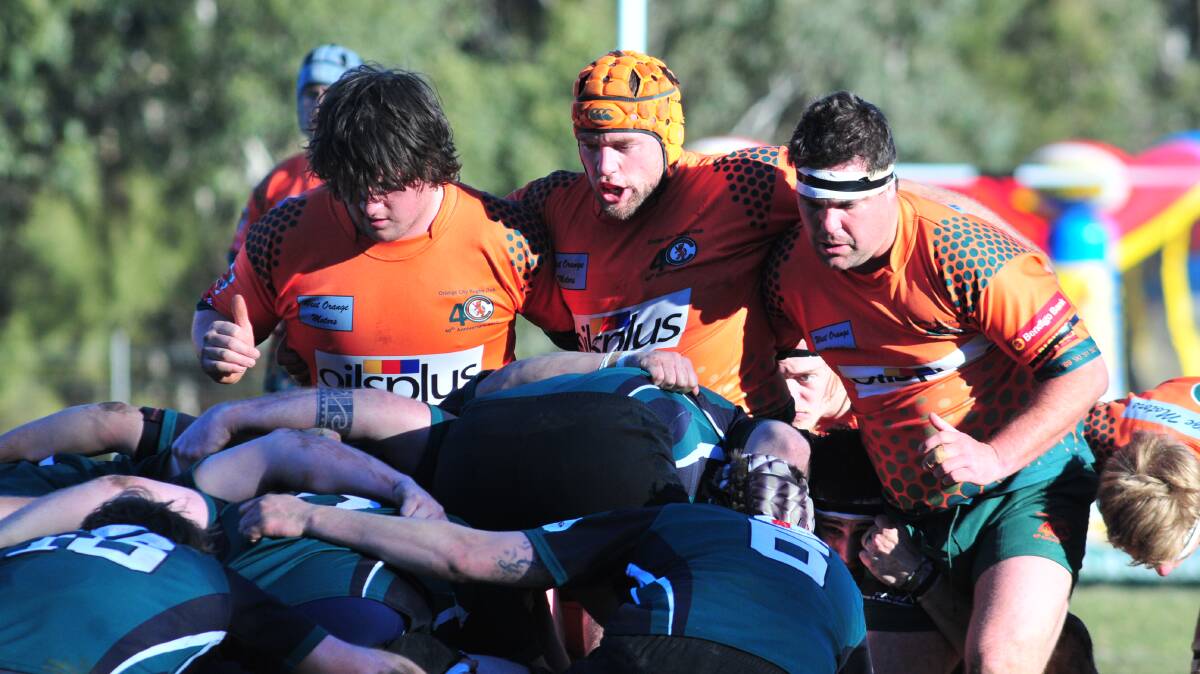 DERBY DAYS: Orange City's front row prepares to crouch, pause and engage in last season's round 18 derby against Orange Emus. Photo: JUDE KEOGH