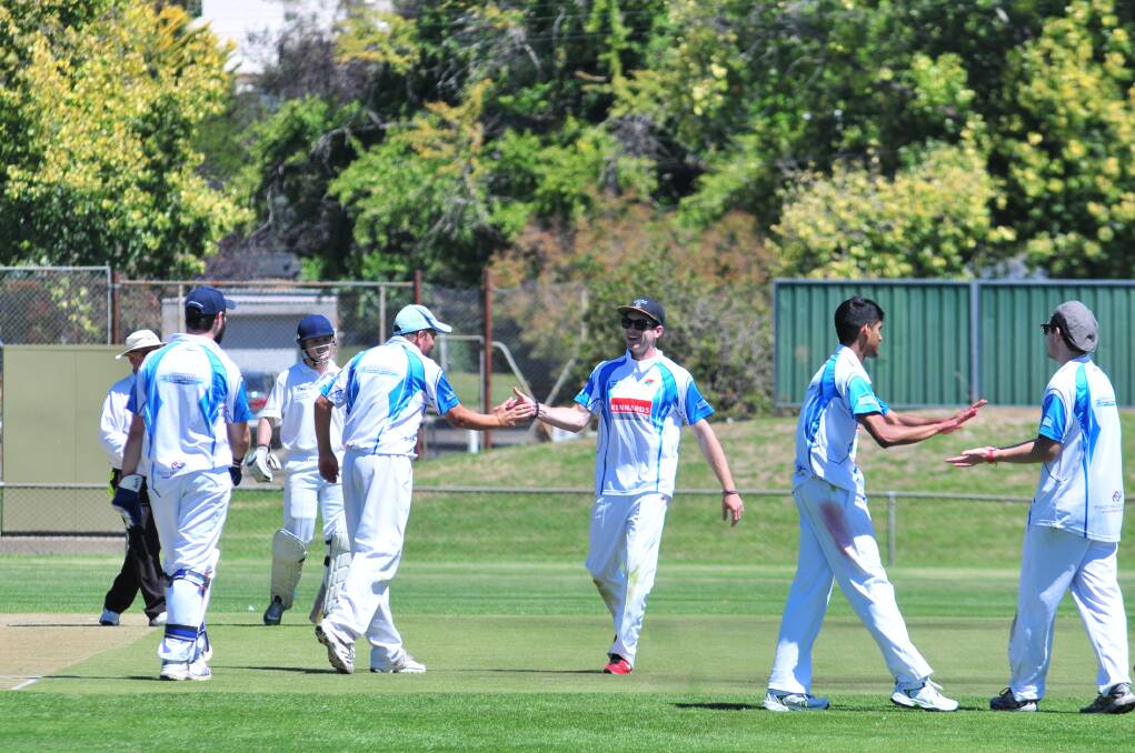 CRICKET: Waratahs celebrate a wicket in Saturday's ODCA first grade game against Centrals at Wade Park. Photo: JUDE KEOGH