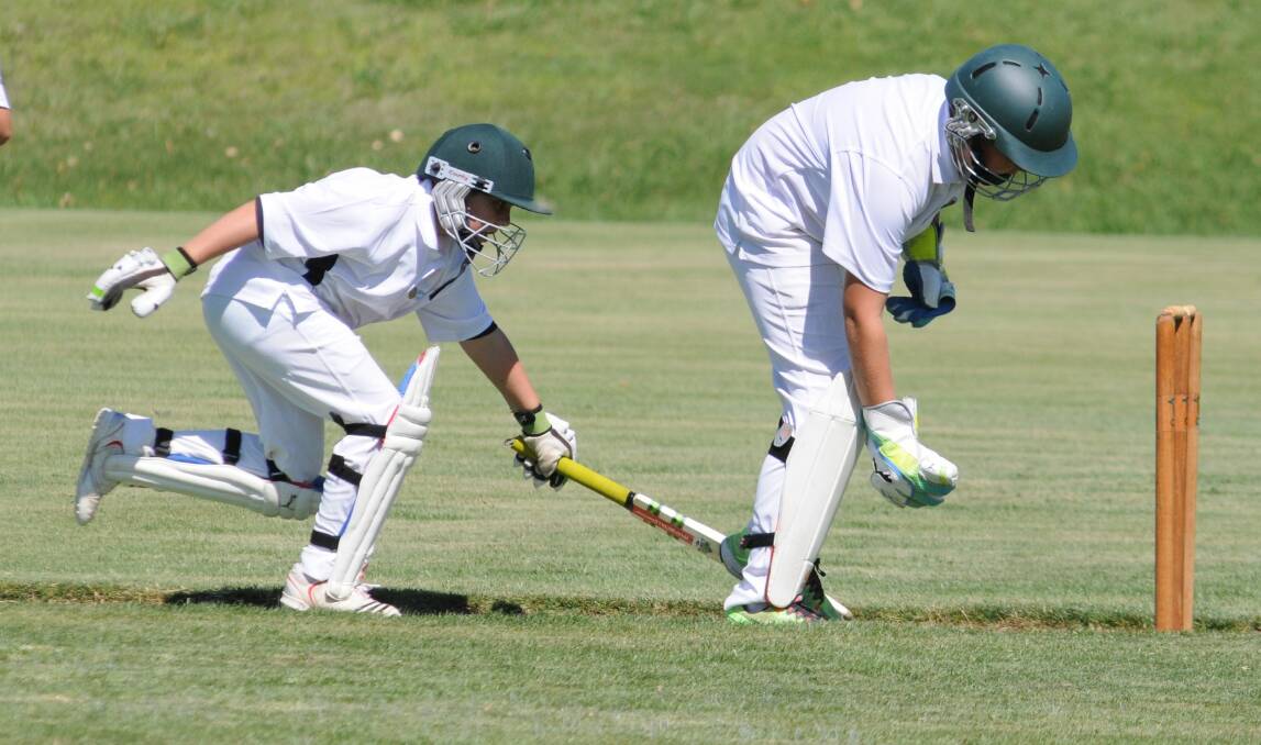 Angus Ellem just makes his ground ahead of keeper Charlie Kilby's effort to break the stumps as CYMS palyed Millthorpe in the under 12s competition. Photo: STEVE GOSCH
