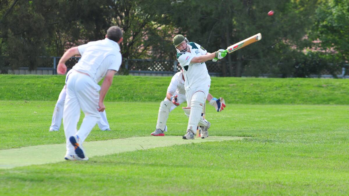 SECOND GRADE: Orange City's Andrew McIntyre hits out against Wanderers at Max Stewart. Photo: JUDE KEOGH