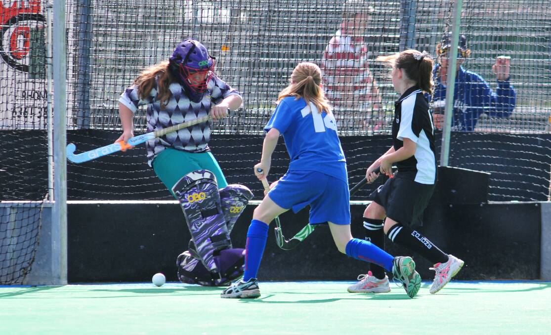 HOCKEY: Isabelle Howarth scores a goal on Saturday morning. Photo: JUDE KEOGH