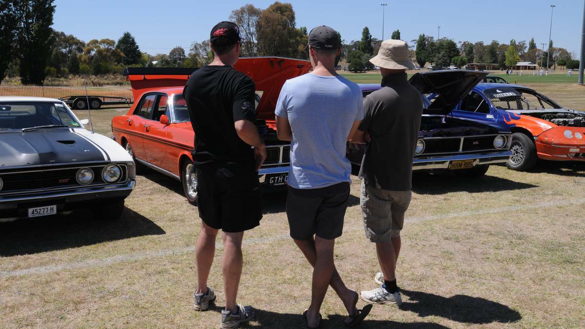 REVVING TO GO: Car enthusiasts check out what's under the hoods at last year's Gnoo Blas classic car show.