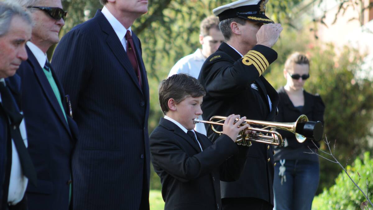 PROUD MOMENT: 13-year-old Lachlan Cisco plays the Last Post. Photo: STEVE GOSCH