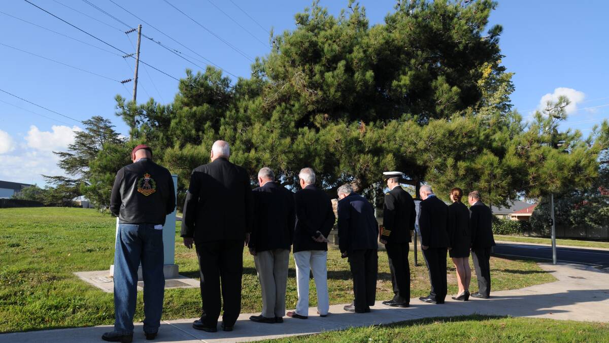 QUIET TIME: A minute's silence at Lonepine on Bathurst Road. Photo: STEVE GOSCH