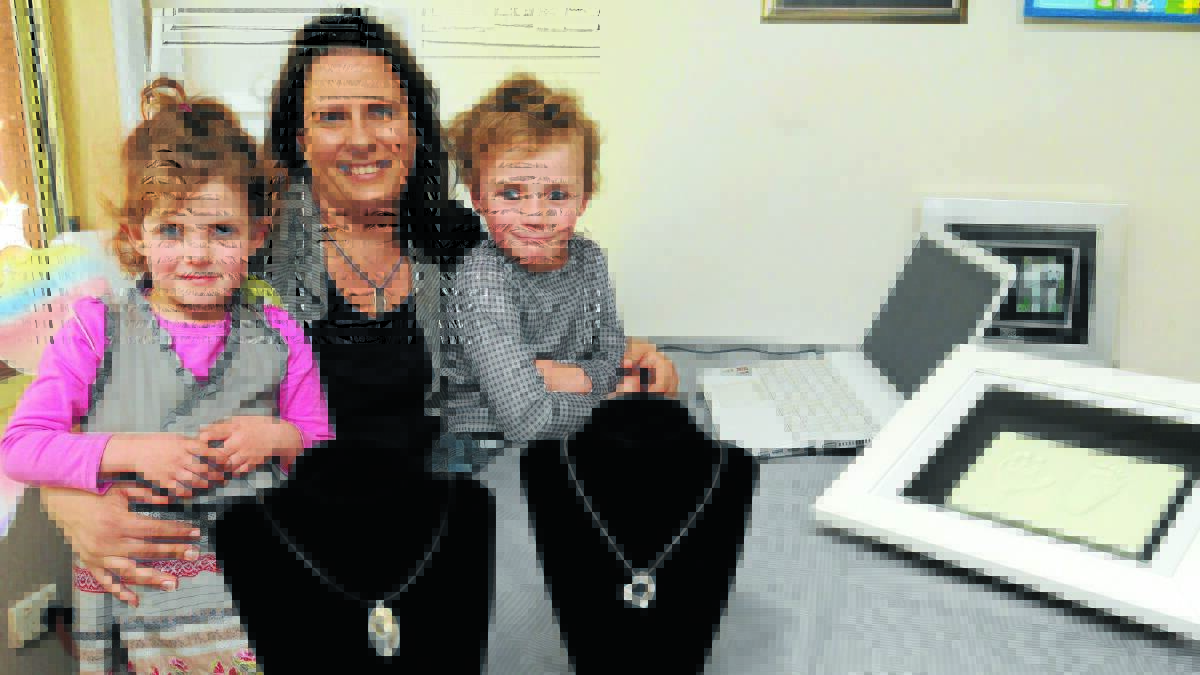 PERFECT MIX: Little Silver Prints business owner Laura Egan with children Lexie and Jake. Photo: STEVE GOSCH                                                                              0730sgegan1