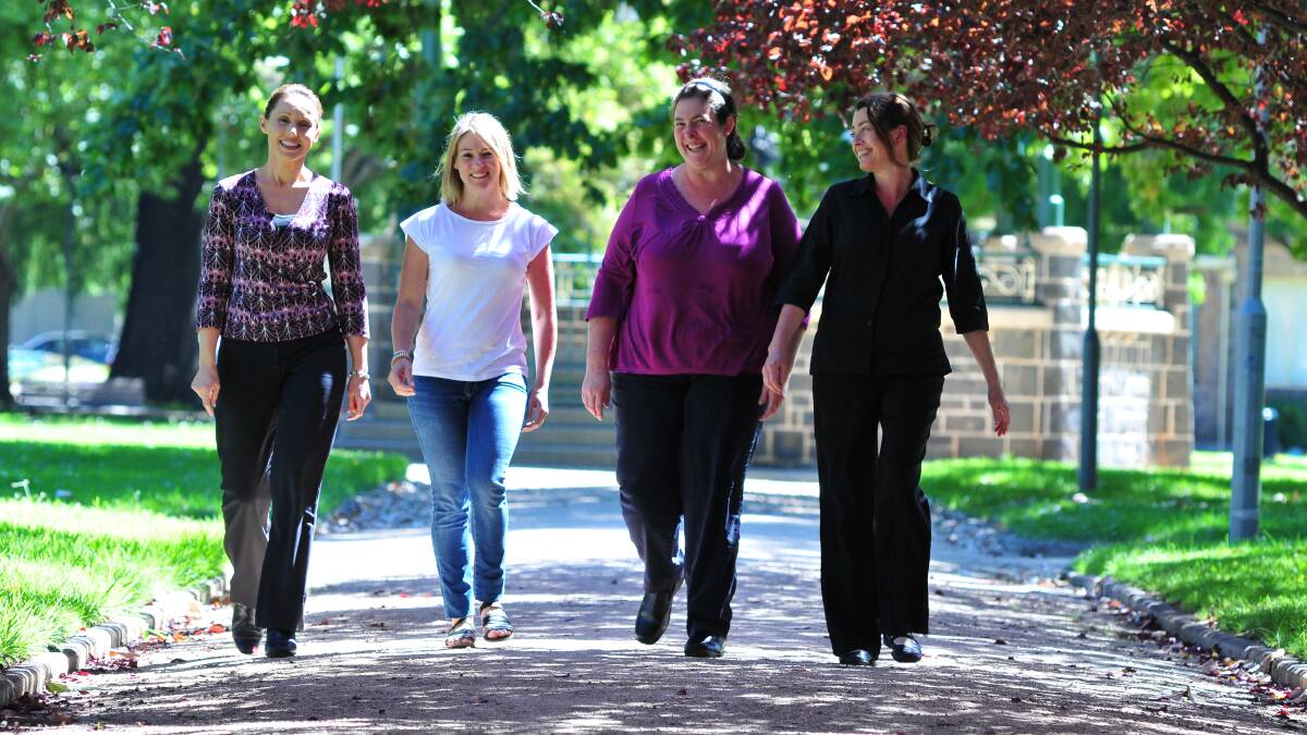 WALKING TOGETHER: Serenity Clarke, Kelly Gleeson, and Tammy Kirby praise the MyTime carer support group and the work of co-ordinator Suzi Welch. Photo: JUDE KEOGH                                                                                                                                                                                                                        0317carers1

