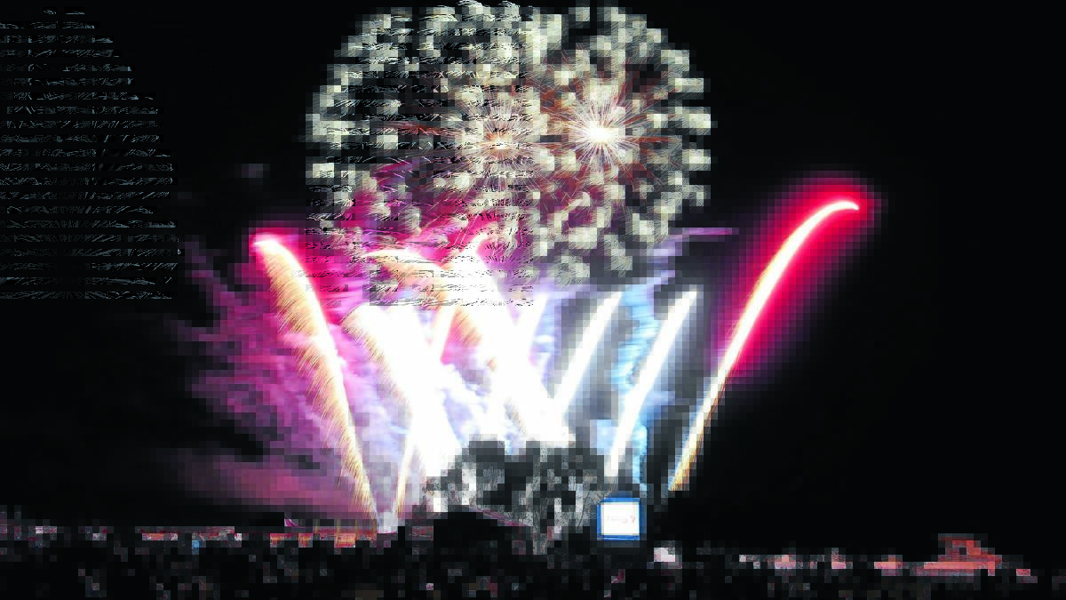 LIGHT SHOW: New Year’s Eve fireworks at Waratah sportsground.
Photo: JUDE KEOGH 