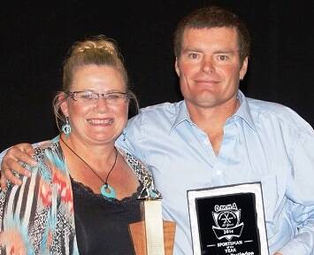 CONGRATULATIONS: Andrew Rutledge was presented with his men's sportsperson of the year award by Beth Shea. 