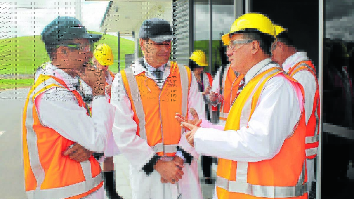 VOTE OF CONFIDENCE: Nestle’s Sulaman Khan and Rafael Lopez talk with member for Calare John Cobb.
Photo: SUPPLIED