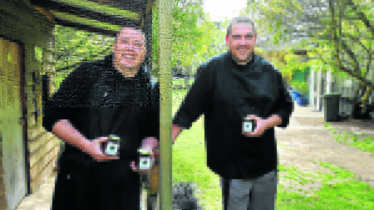 WINNERS ARE GRINNERS: Huntley Berry Farm cooks John Palmer and Luke Mavrak are pleased to have won medals for their preserves. Photo: JUDE KEOGH                                                                                                                                                                                  0917berryfarm1