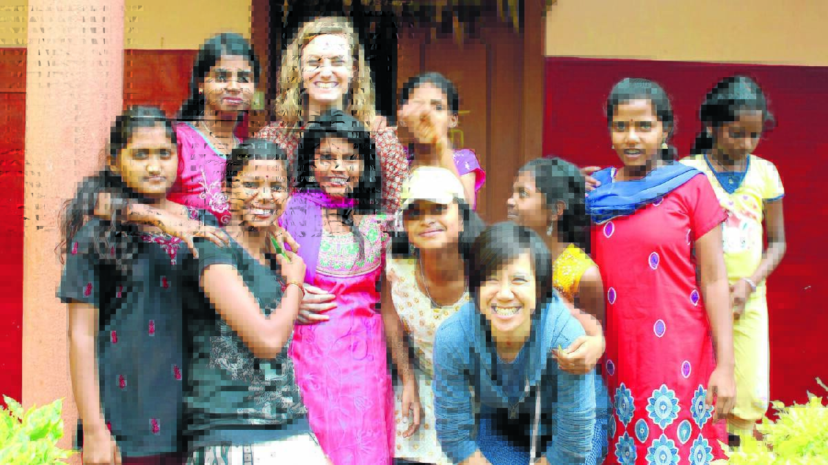 HELP WANTED: Danielle Edwards, with Baale Mane residents, hopes to raise more funds to expand the girls’ home she works for in India.
                                                                                                                                                                                                                        Photos: SUPPLIED
