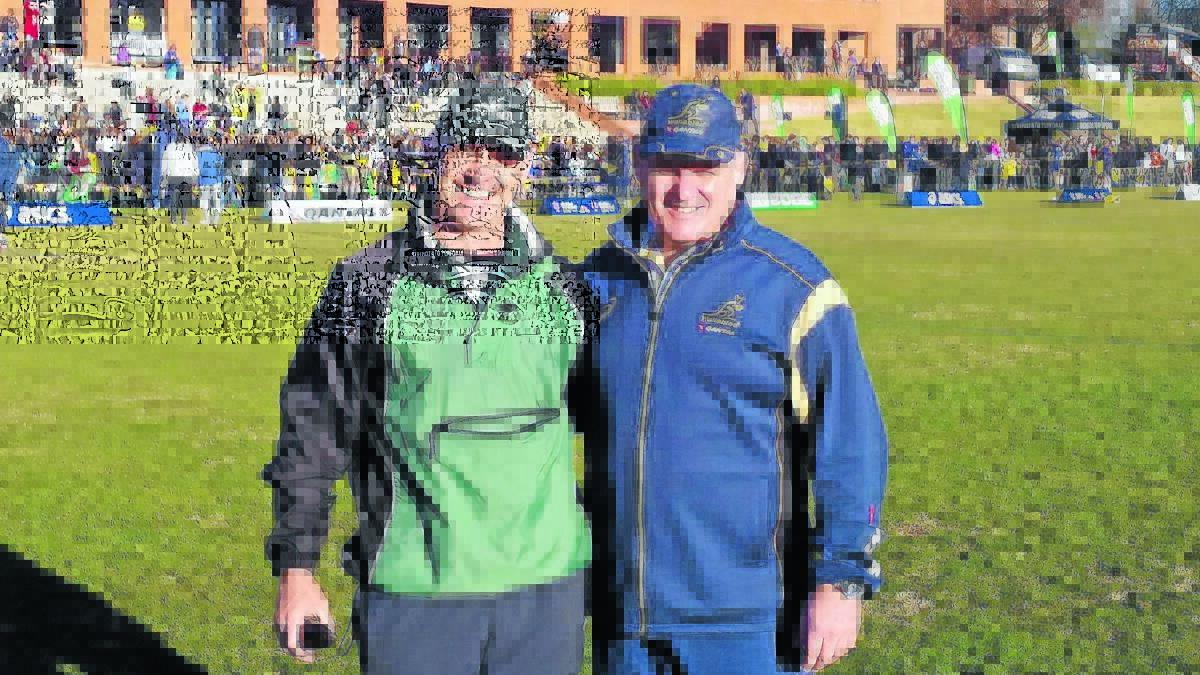 JUST REWARD: Orange Emus coach Andrew Logan (pictured with Wallabies mentor Ewen McKenzie) has been nominated for the Asteron Life Community Coach of the Year award.