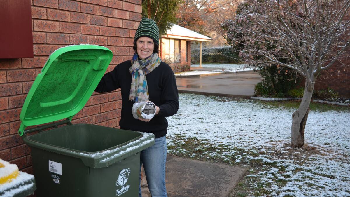 NO PLASTIC BAG BIN LINERS:  Fiona Hawke wraps her food scraps in newspaper before putting them in the green-lid bin.
