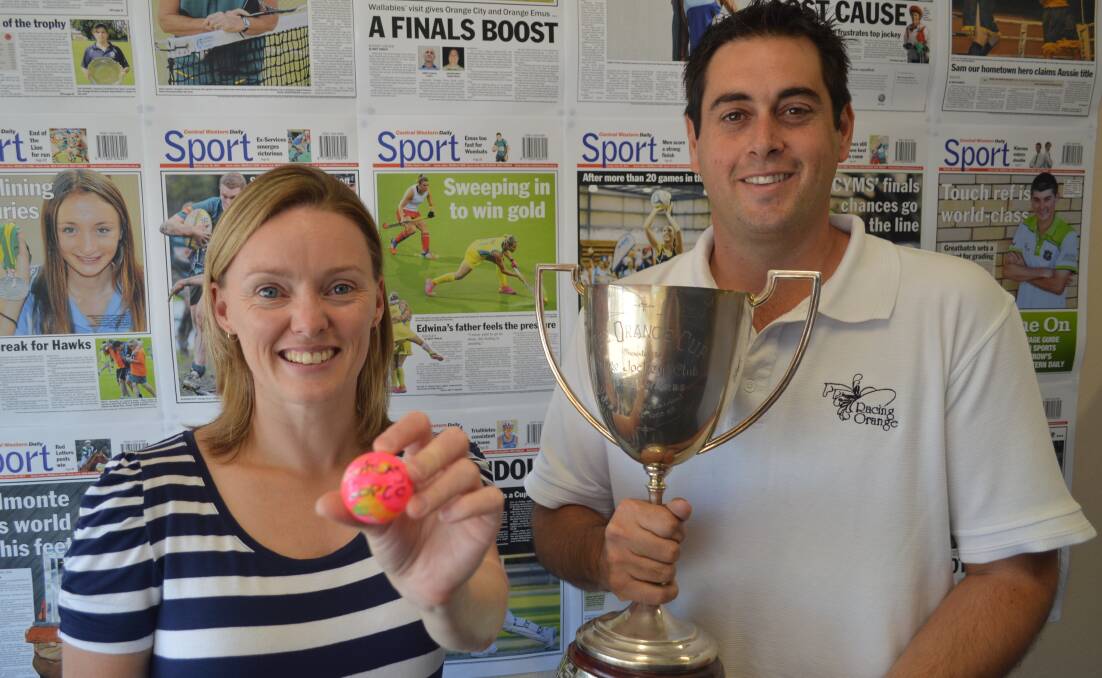 AND THE WINNER IS: Central Western Daily sports editor Michelle Cook and Racing Orange chief executive Dan Brincat were on hand to draw the winner of the Orange Gold Cup naming rights raffle yesterday.
Photo: MATT FINDLAY 0304mfracedraw